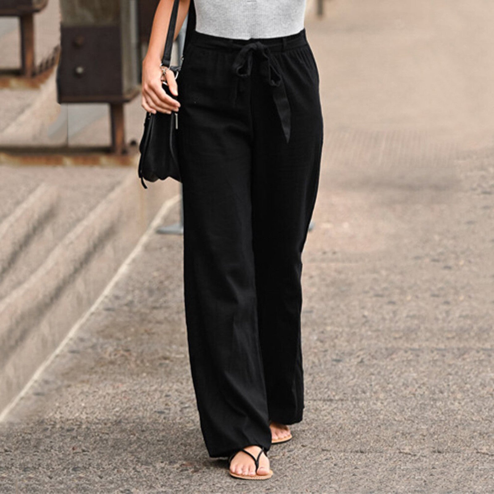 Women's beige relaxed-fit linen pants with elastic waistband and adjustable tie closure