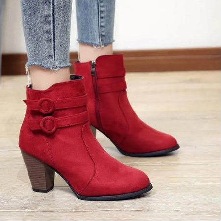 Women's black zip-up ankle boots with side buckle details for chic everyday style