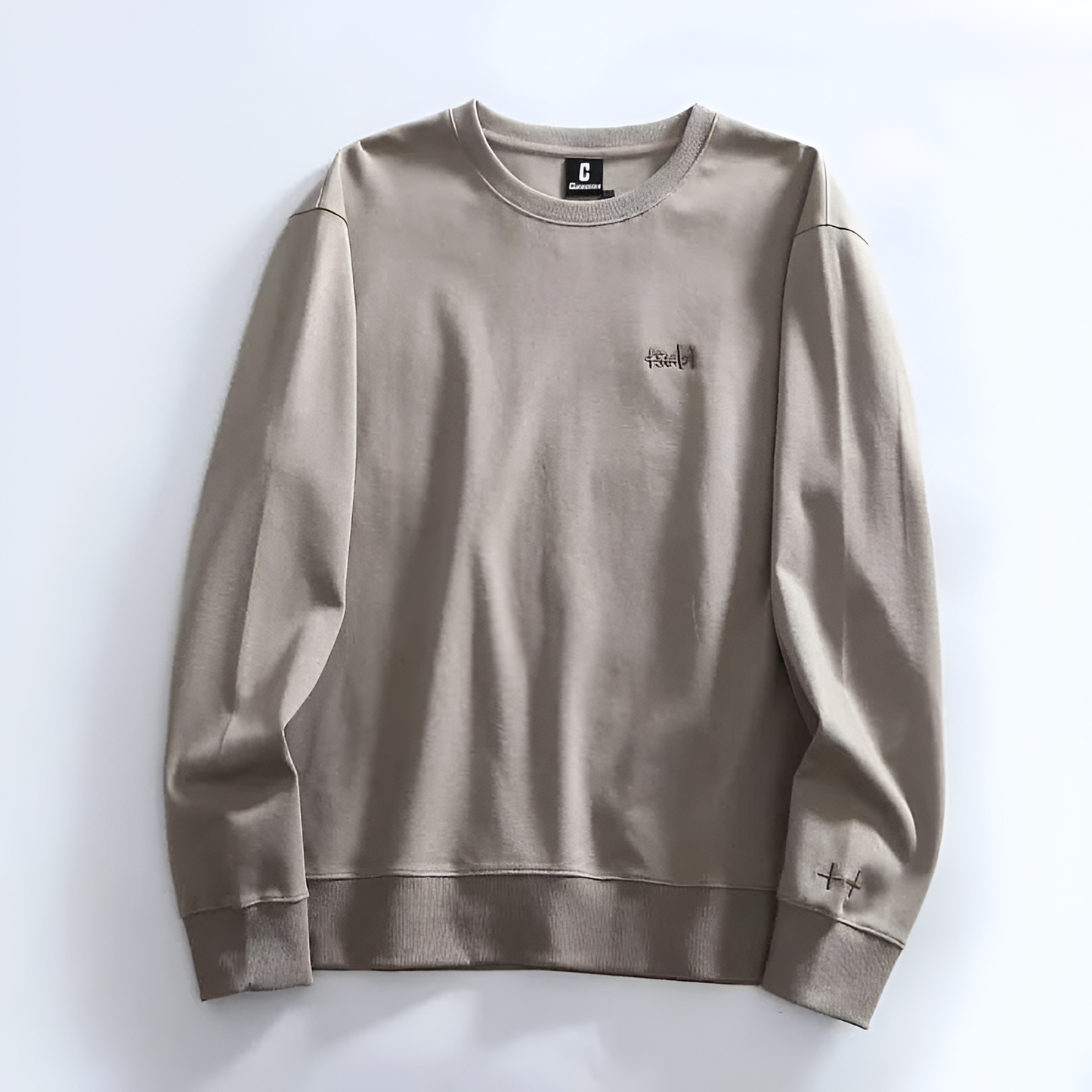 Minimalist crewneck sweatshirt soft fabric relaxed fit subtle embroidery everyday casual style