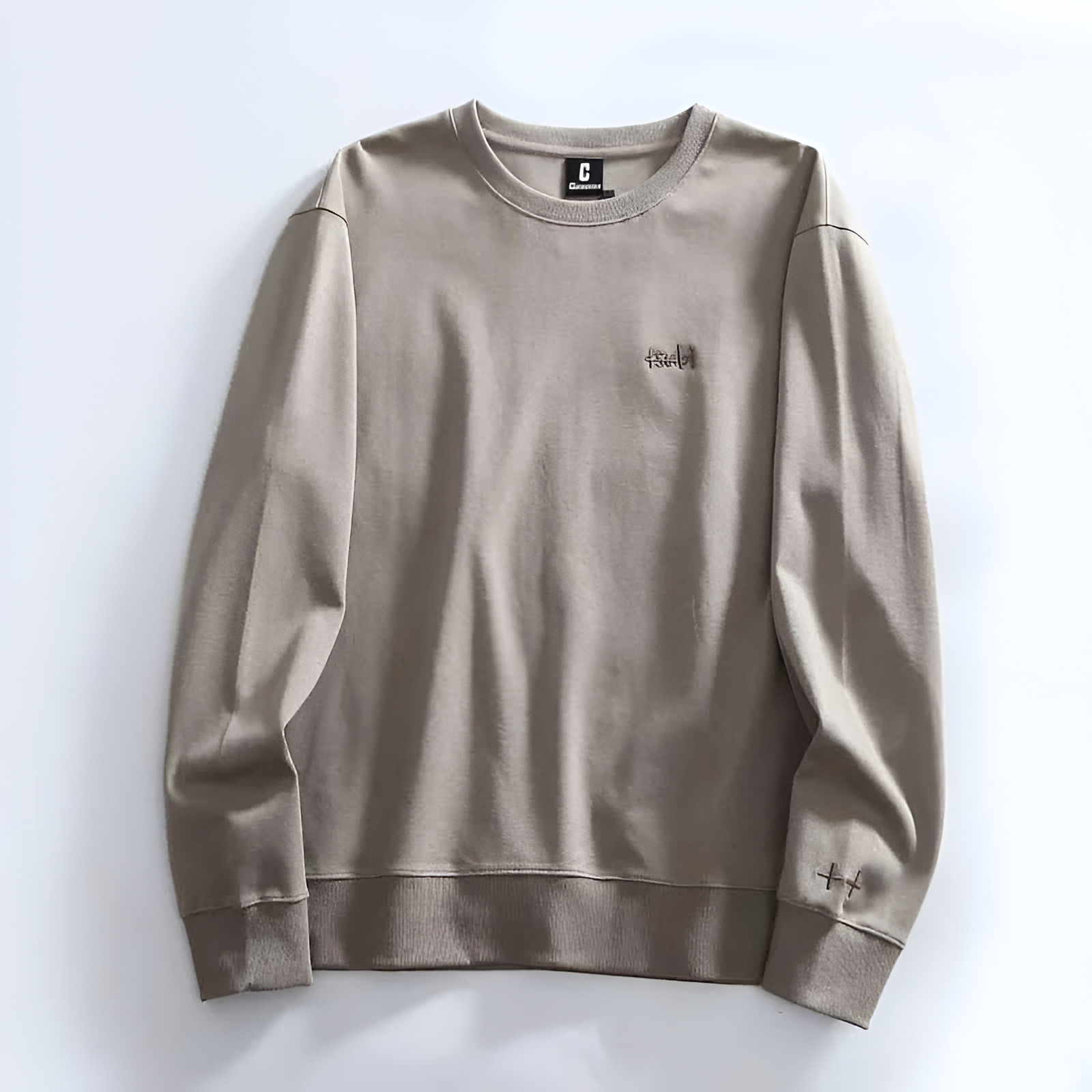 Minimalist crewneck sweatshirt soft fabric relaxed fit subtle embroidery everyday casual style
