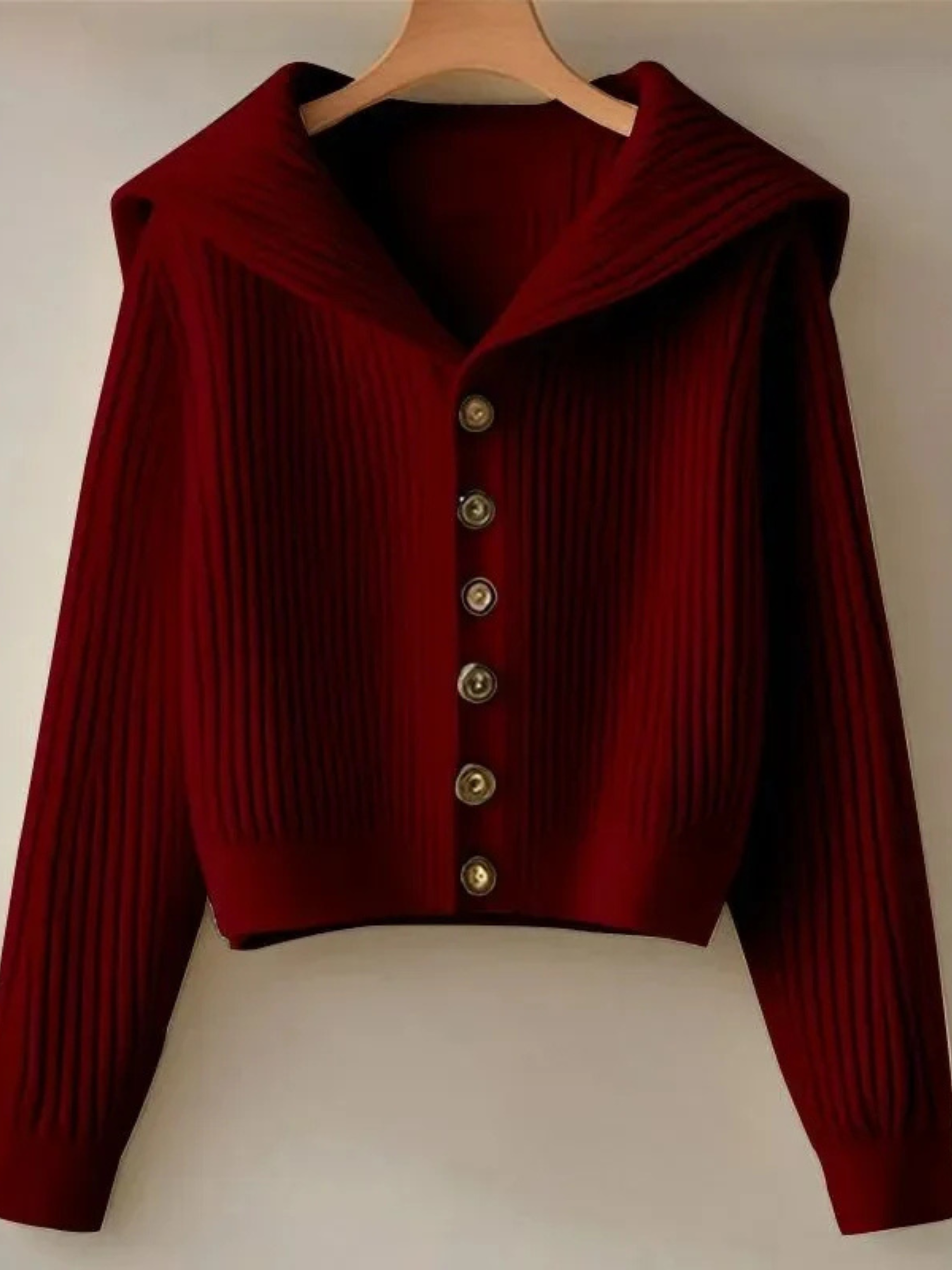 Cropped ivory rib knit cardigan with dramatic oversized sailor collar and waist-defining silhouette