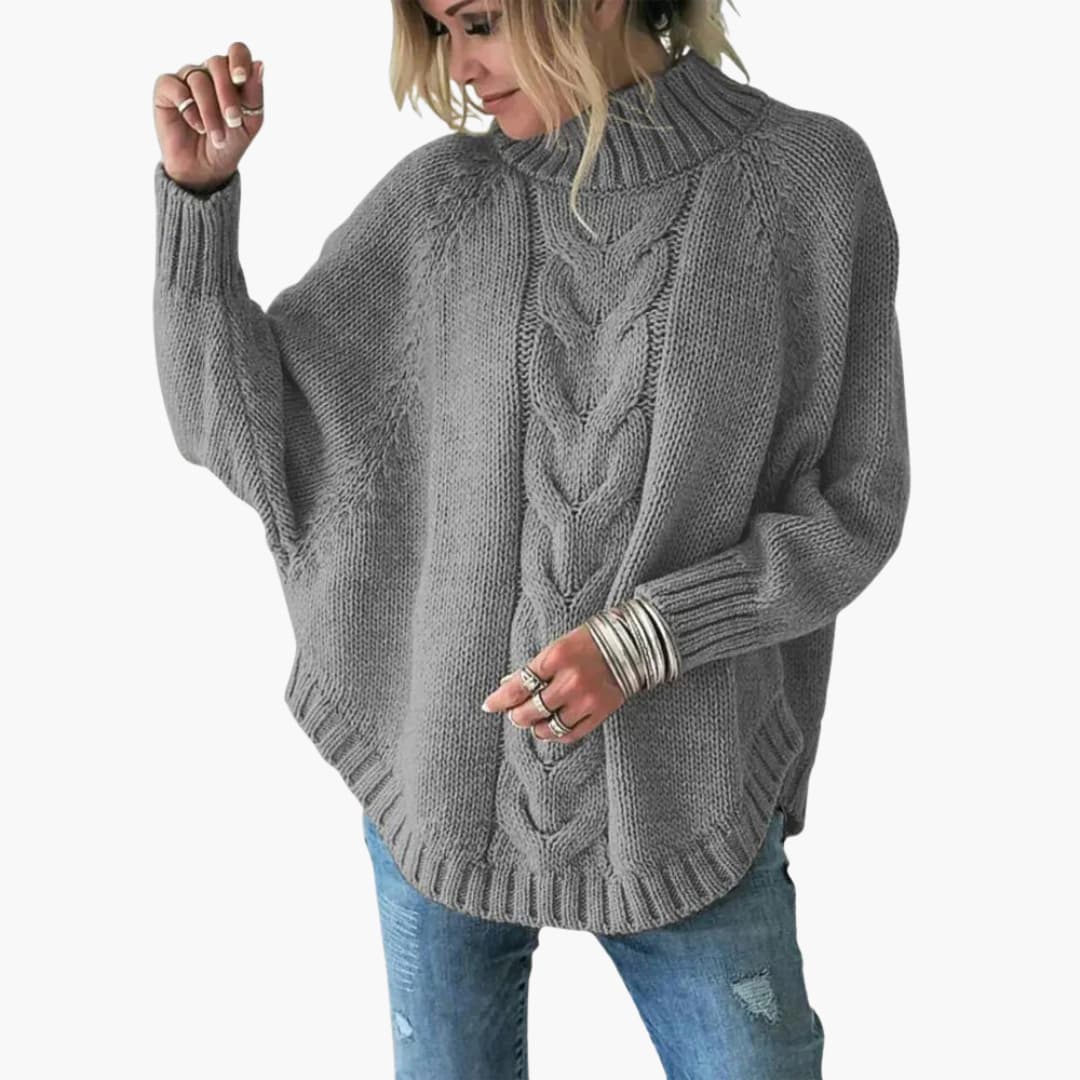 Women's cream cable knit turtleneck sweater with ribbed cuffs and hem for cozy winter style