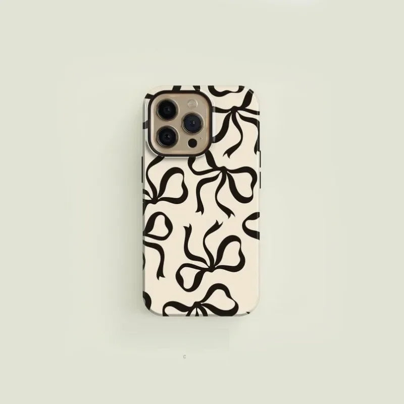 Black bow-pattern iPhone case slim glossy finish elegant couture design robust everyday protection