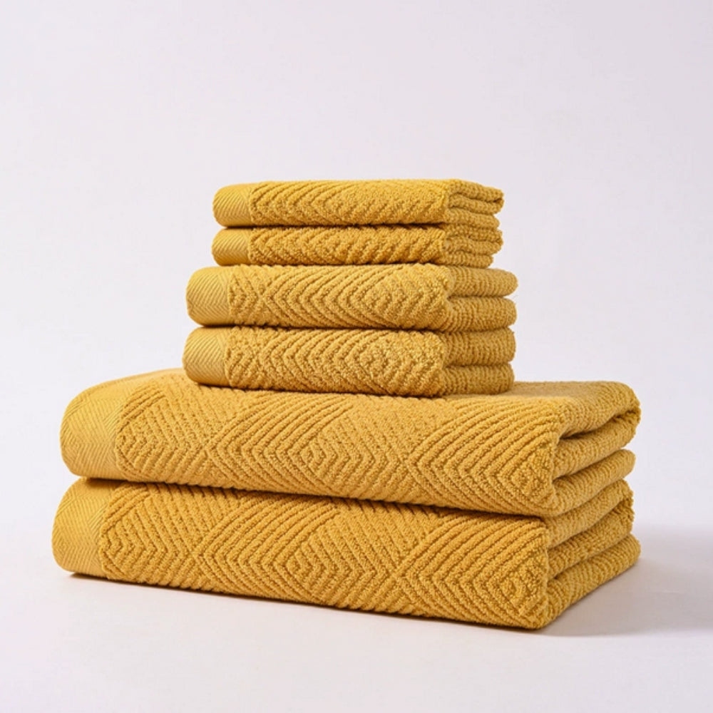 Soft white chevron-pattern cotton bath towel set, minimalist spa-inspired absorbent textured weave