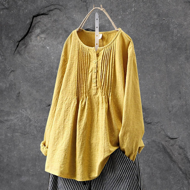 Women's boho chic white ruffle blouse with button-front placket and relaxed feminine silhouette