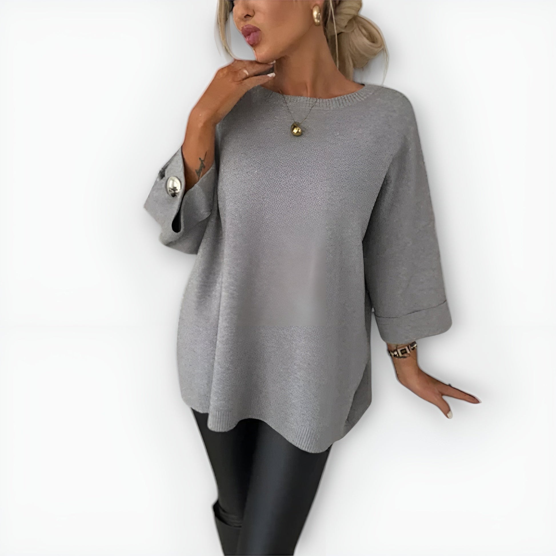 Women's oversized cream knit sweater relaxed fit fluid drape with button-accent sleeves
