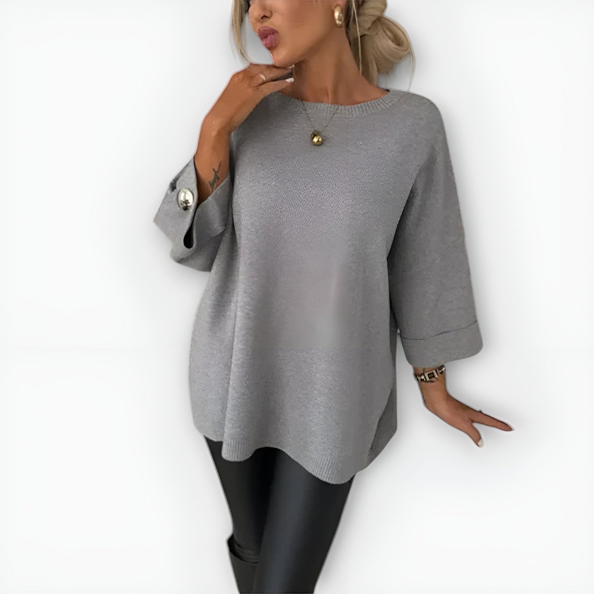 Women's oversized cream knit sweater relaxed fit fluid drape with button-accent sleeves