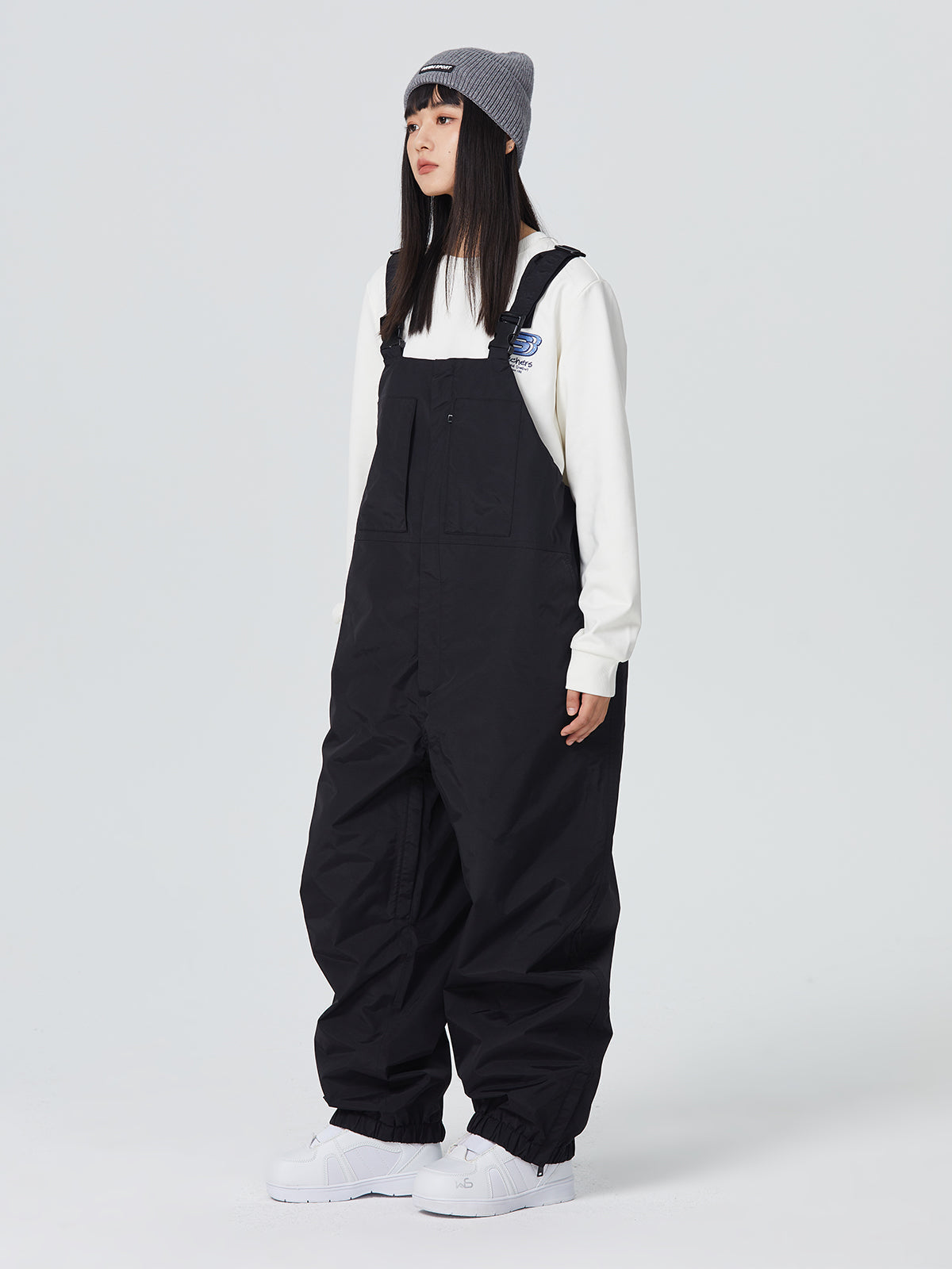 Women's baggy snowboard pants in bold colors with 10K waterproof taped seams and boot gaiters