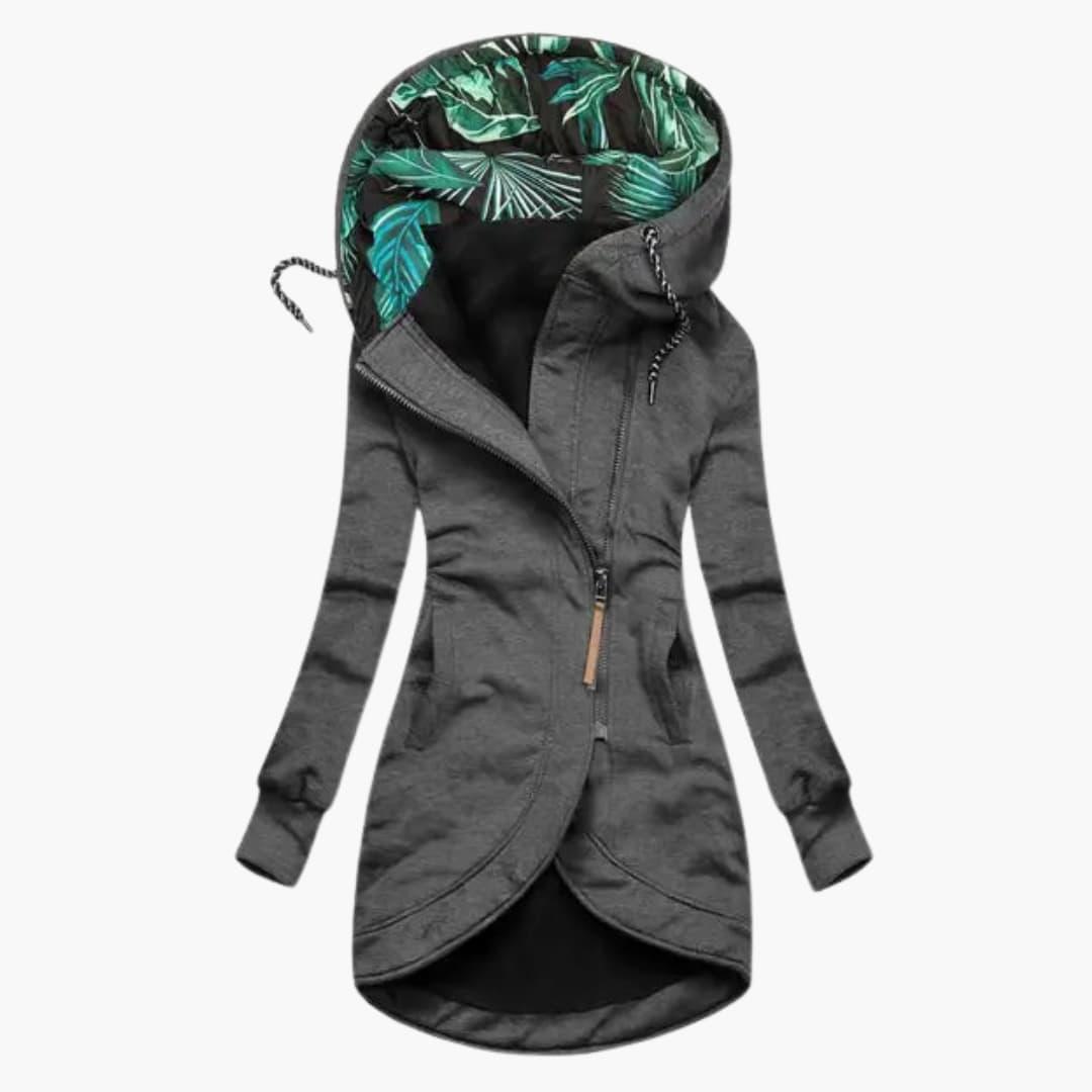 Women's quilted winter jacket with fixed hood, raised neckline, and large front pockets for cozy warmth