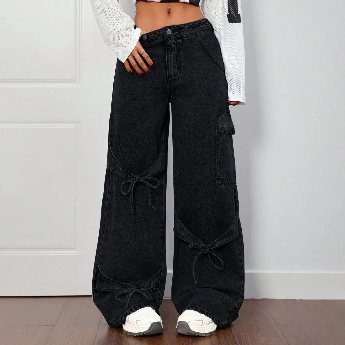 Women's wide-leg faded denim jeans high-waisted silhouette with bold bow-tie side detail