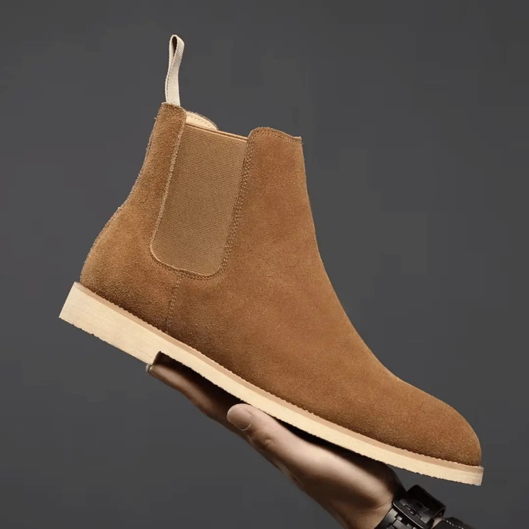 Olive green suede Chelsea boots with elastic side panels and slip-on design for everyday wear