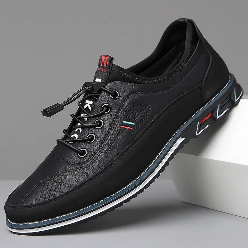 Men's low-profile PU leather sneaker with textile upper and structured outsole for everyday comfort