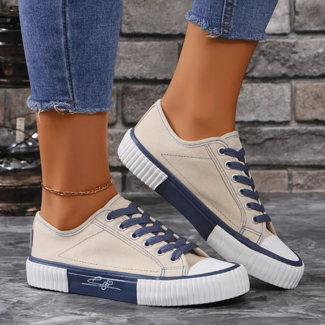 Women's white canvas sneakers lightweight breathable streamlined silhouette with arch support