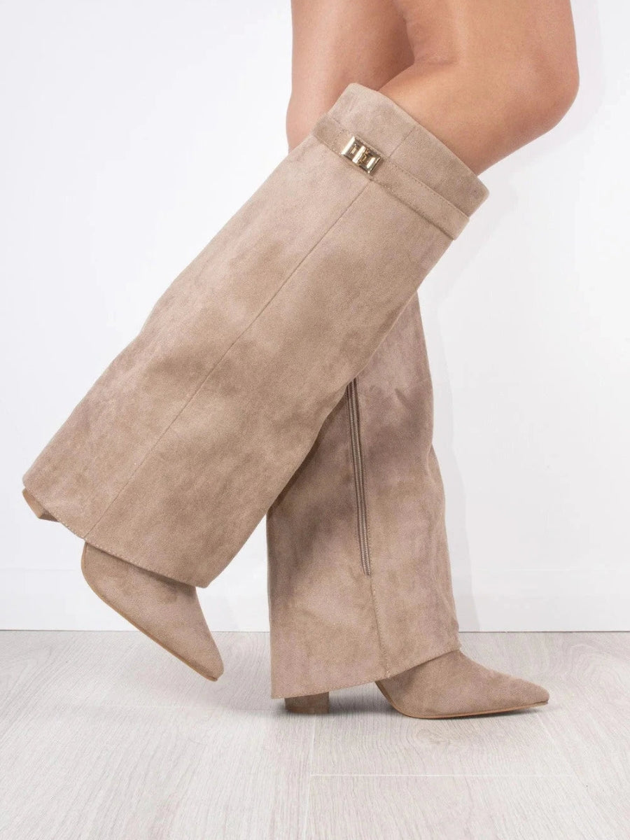 Women's black slouchy thigh-high boots with pointed toe and foldover shaft for elegant chic style