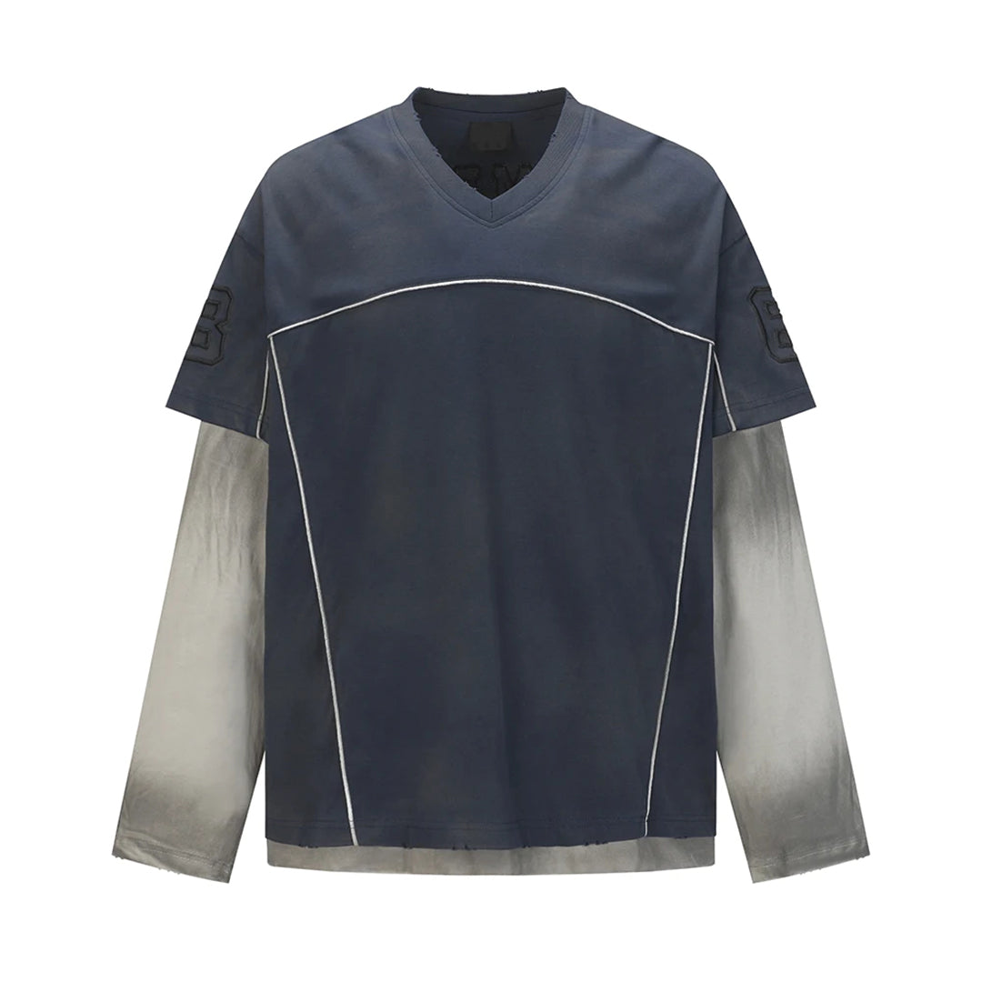 White cotton V-neck tee with spliced layered panels and subtle embroidered accents for a textured look