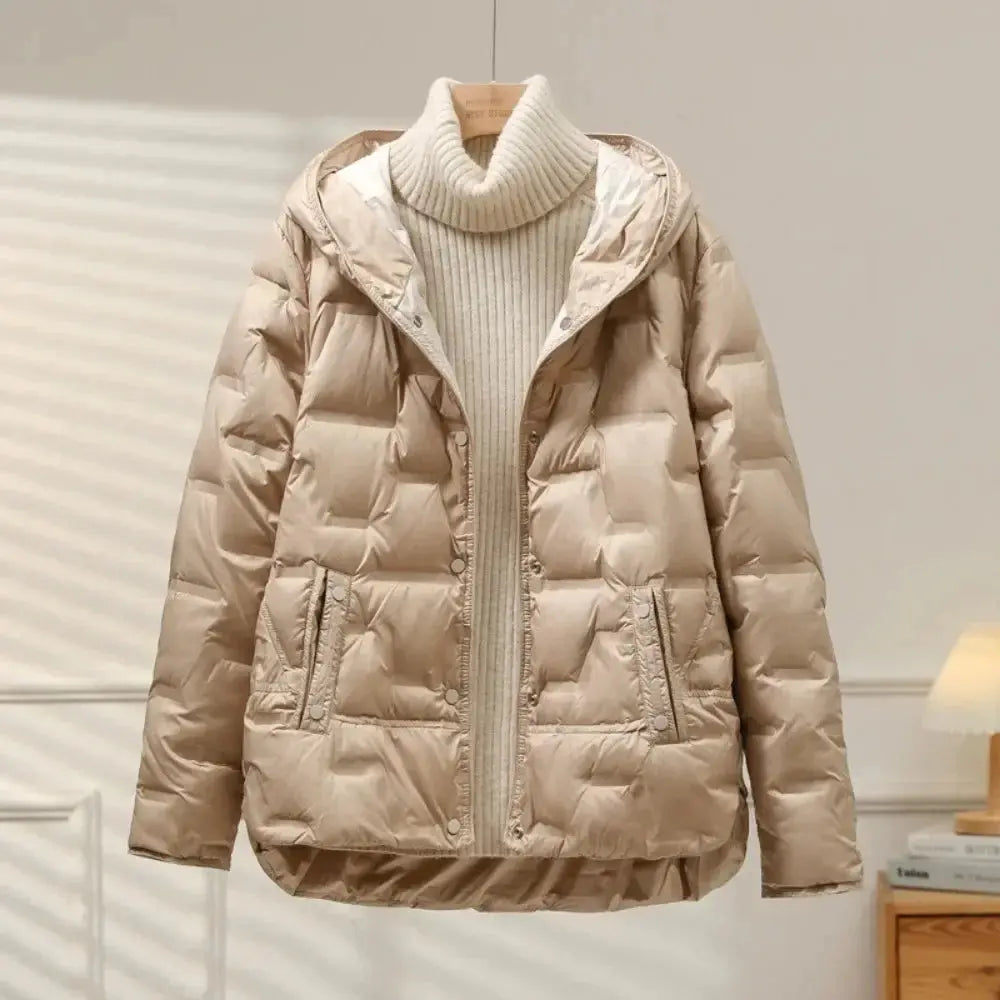 Women's quilted down puffer jacket in neutral tone, snap closure, lightweight duck down fill