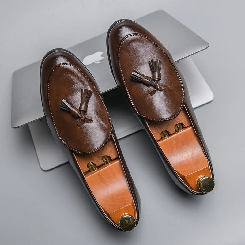 Men's high-shine leather tassel loafers with polished finish and minimalist silhouette for formal wear