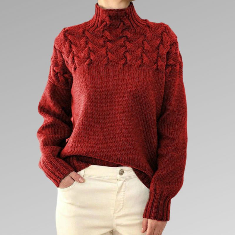 Women's ivory cable knit high-neck sweater with raised textured pattern across upper bodice