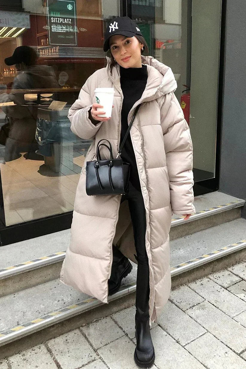 Women's long black puffer coat with full-coverage silhouette and ultra-warm insulation