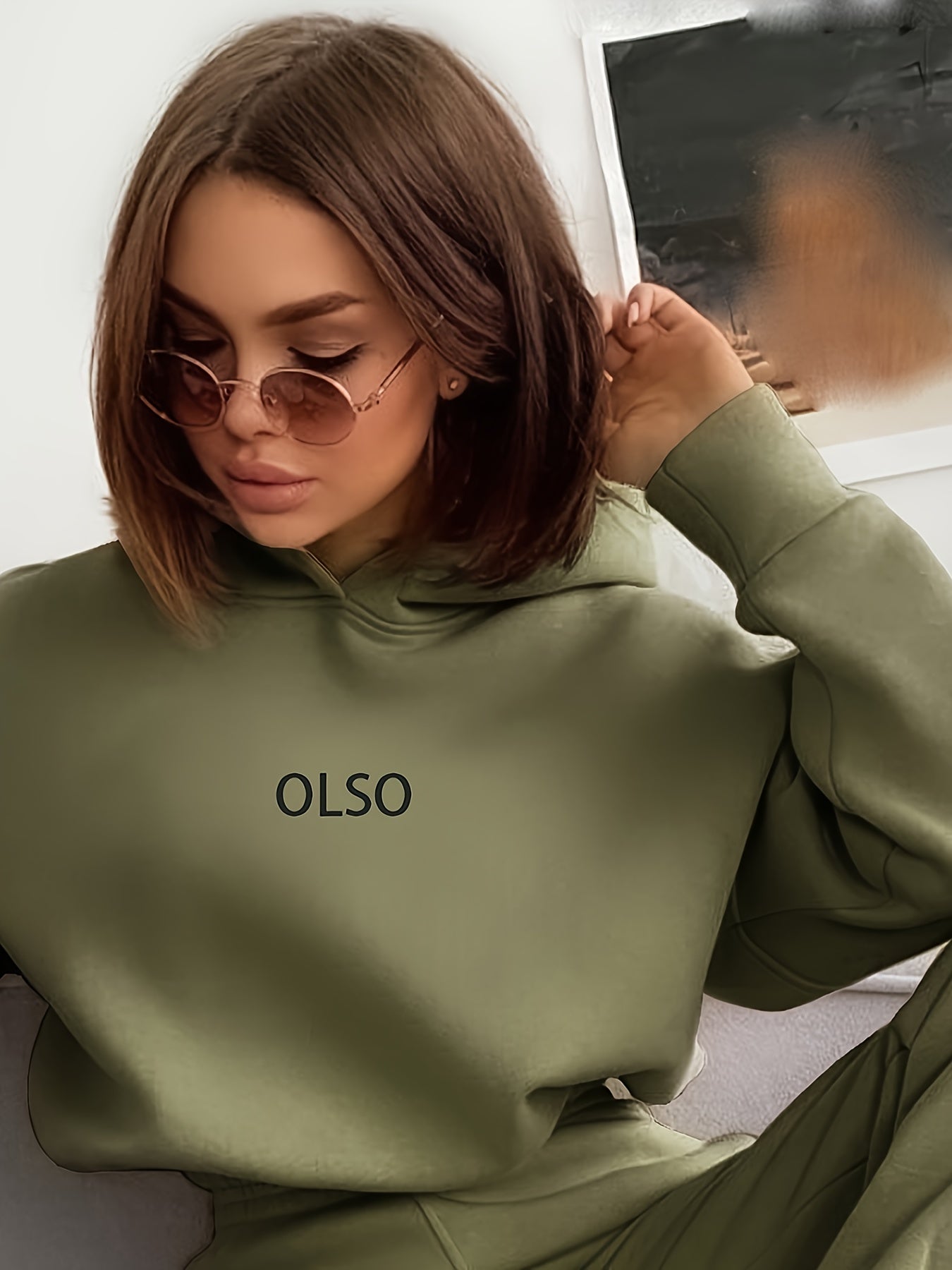 Women's coordinated hoodie and sweatpants tracksuit set in sustainable fabric for casual everyday wear