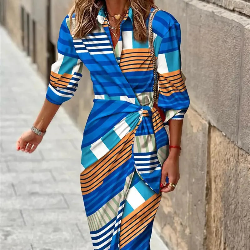 Women's bold printed wrap midi dress with V-neck, belted waist tie, and lightweight flowing silhouette