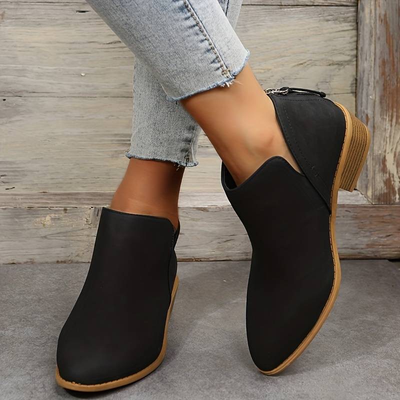 Women's casual slip-on ankle boots with low block heel and side opening, sleek silhouette