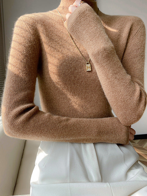 Women's beige ribbed knit turtleneck sweater with flattering slim fit and high neck detail
