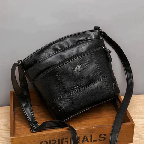 Carolyn vegan leather crossbody bag with multiple compartments and adjustable strap for women