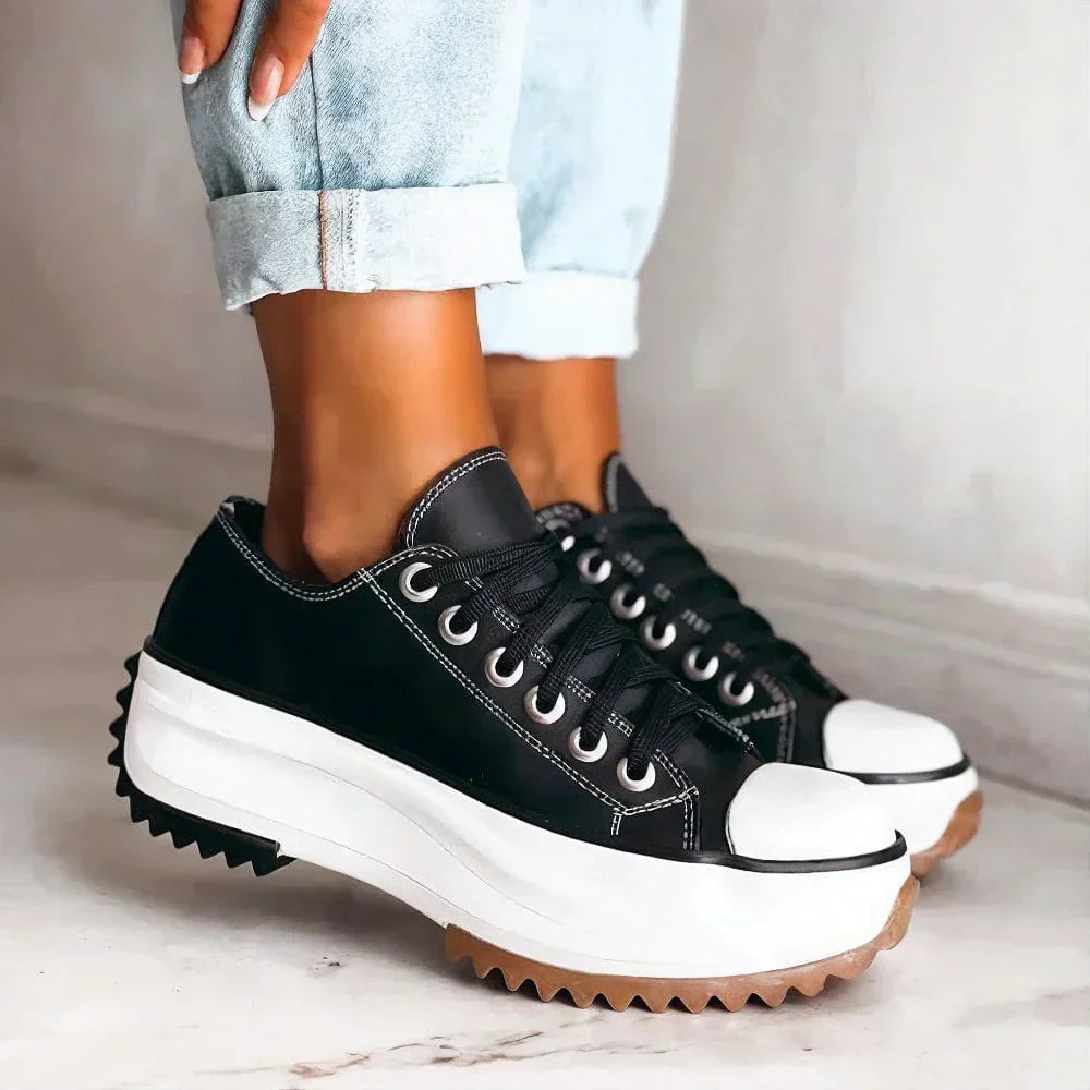 Women's white chunky platform orthopedic sneakers with bold elevated sole for all-day comfort