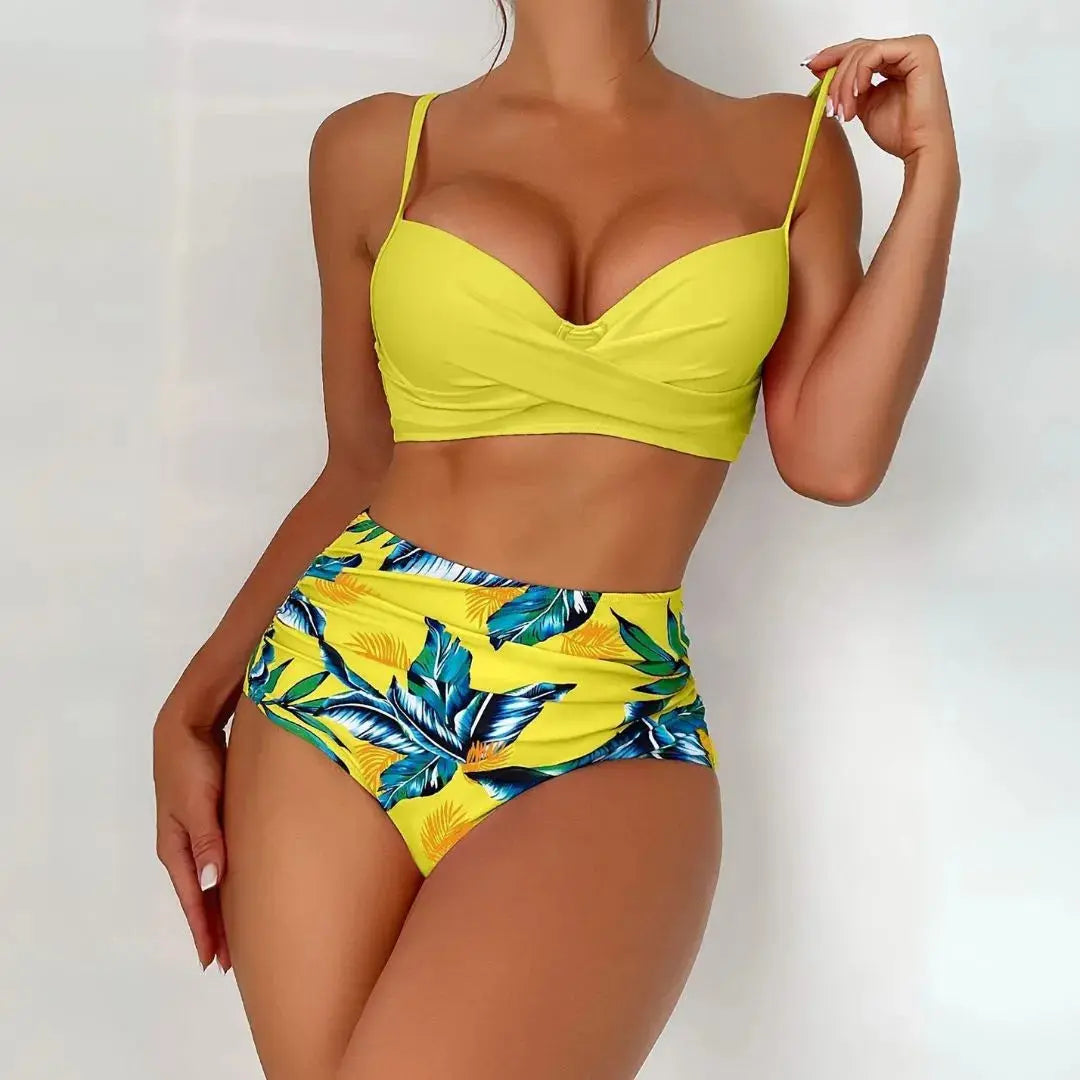 Tropical floral bikini set with twist-front top and high-waisted ruched bottoms, adjustable straps