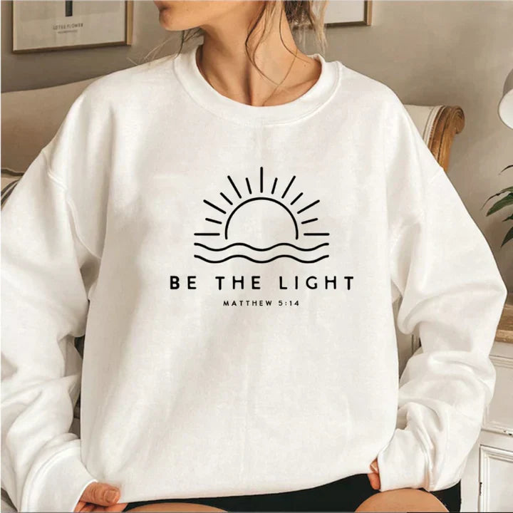 Women's casual grey knit jumper with "Be the Light" slogan print, relaxed fit sustainable knitwear