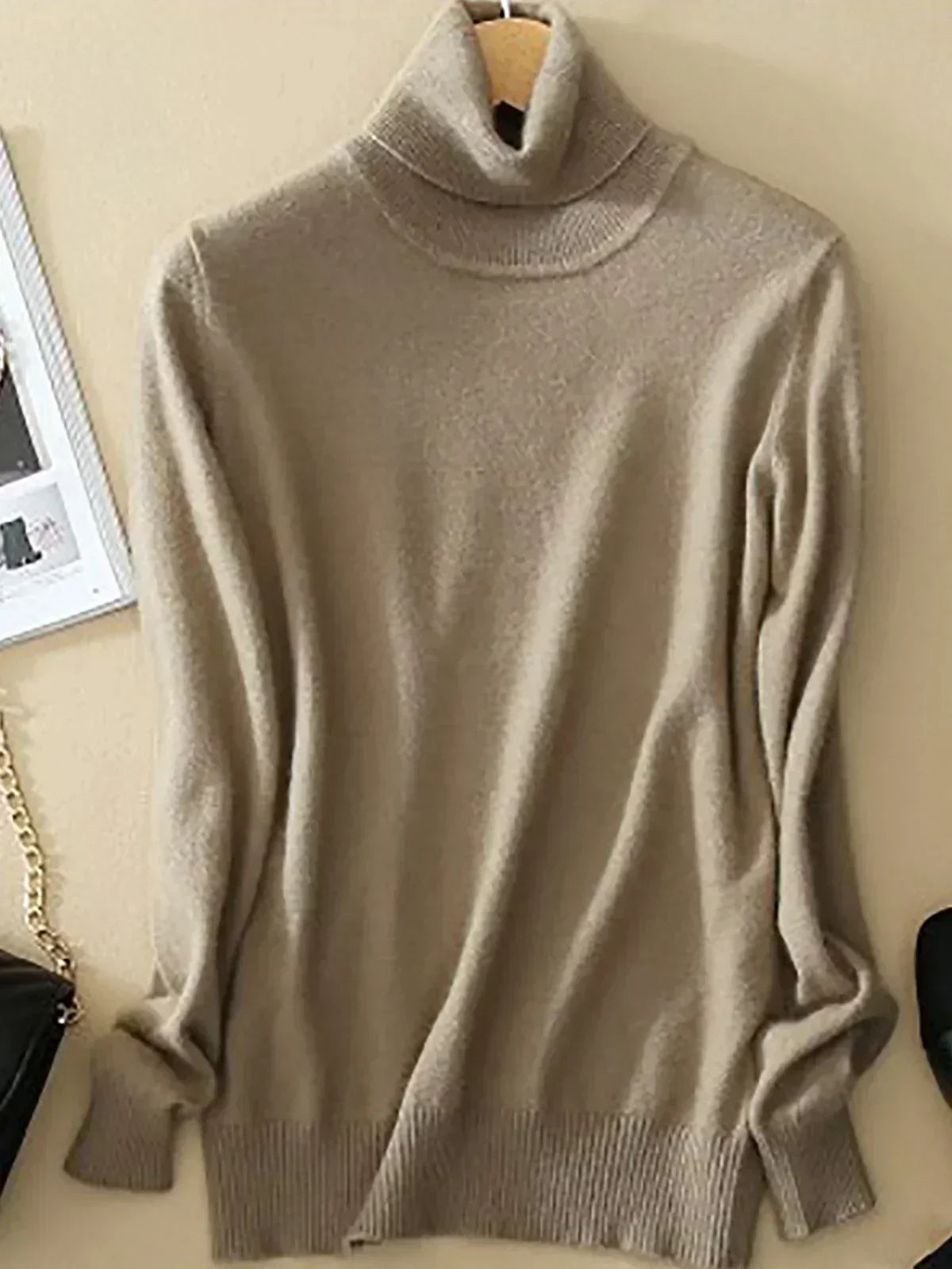 Women's slim-fit premium turtleneck sweater in neutral tone with sleek minimalist silhouette