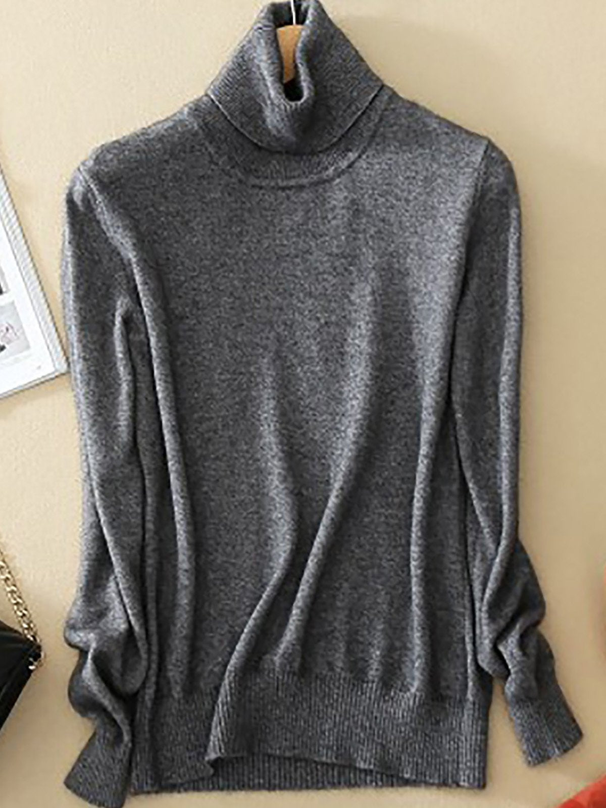 Women's slim-fit premium turtleneck sweater in neutral tone with sleek minimalist silhouette