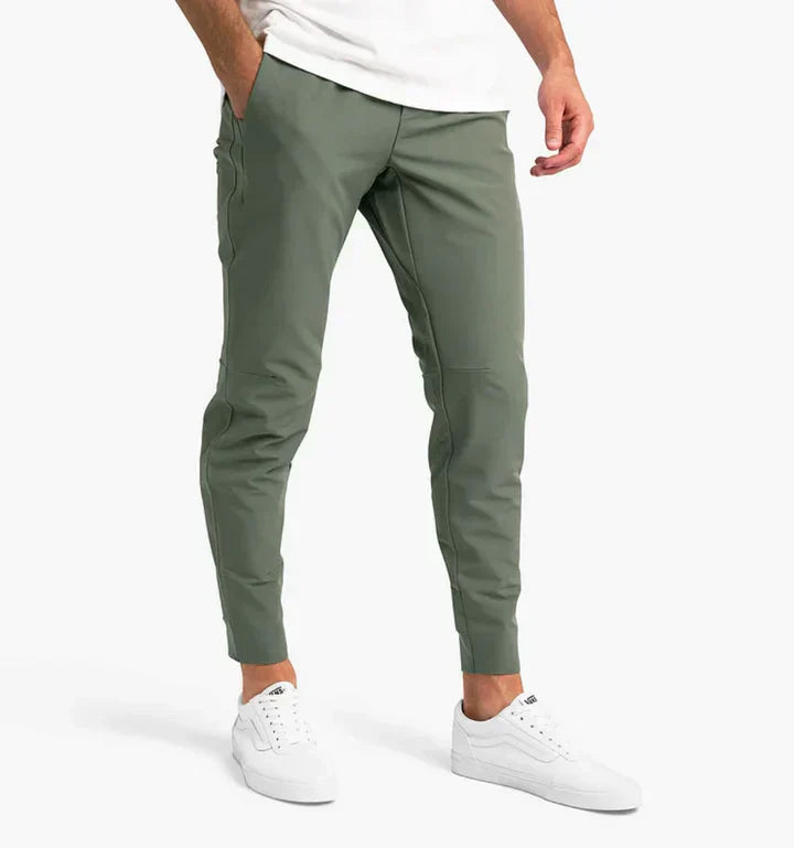Men's slim-fit suit trousers in classic neutral tone with flexible comfort waistband for professionals