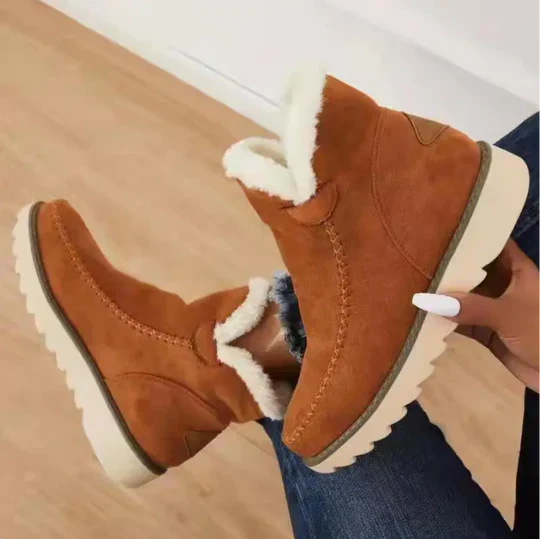 Women's plush sheepskin boots cozy winter style warm lining luxurious cold-weather footwear