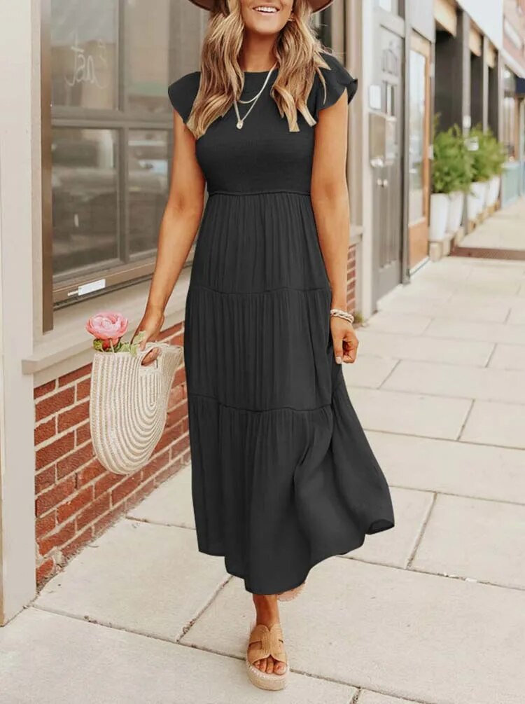 Women's lightweight summer dress with ruffle accents, functional pockets, sustainable fabric, effortless fit