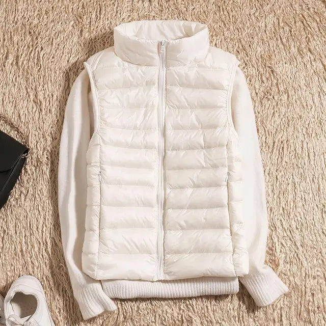 Women's lightweight quilted down vest high collar insulated warm layer sleek silhouette
