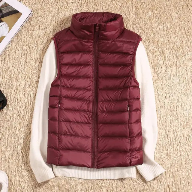 Women's lightweight quilted down vest high collar insulated warm layer sleek silhouette transitional