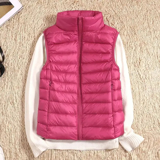 Women's lightweight quilted down vest high collar insulated warm layering piece sleek silhouette