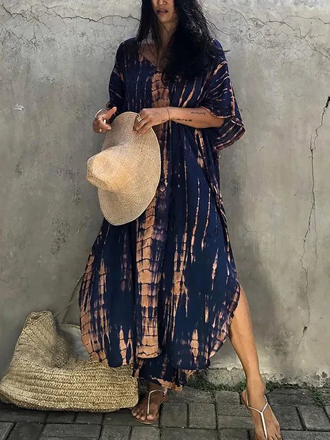 Women's boho tie-dye caftan maxi dress, V-neck loose fit with vibrant batik print for beach resort