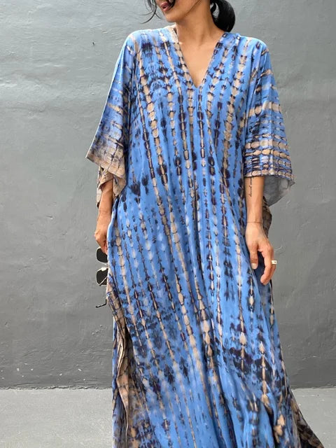 Women's boho tie-dye caftan maxi dress, V-neck loose fit with vibrant batik print for beach resort