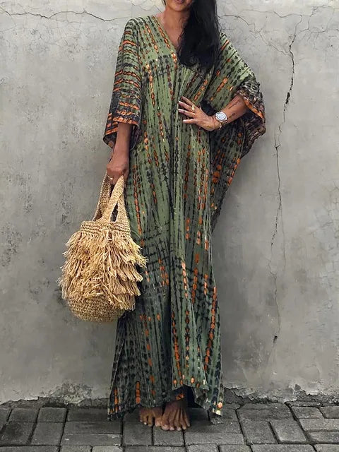 Women's boho tie-dye caftan maxi dress, V-neck loose fit with vibrant batik print for beach resort