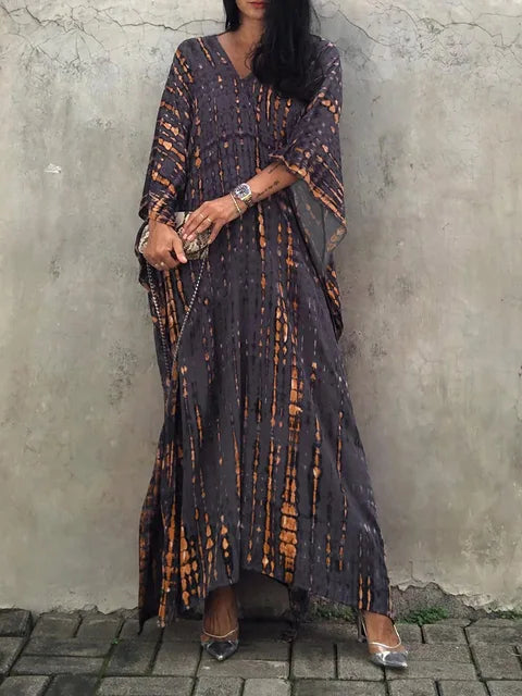 Women's boho tie-dye caftan maxi dress, V-neck loose fit with vibrant batik print for beach resort