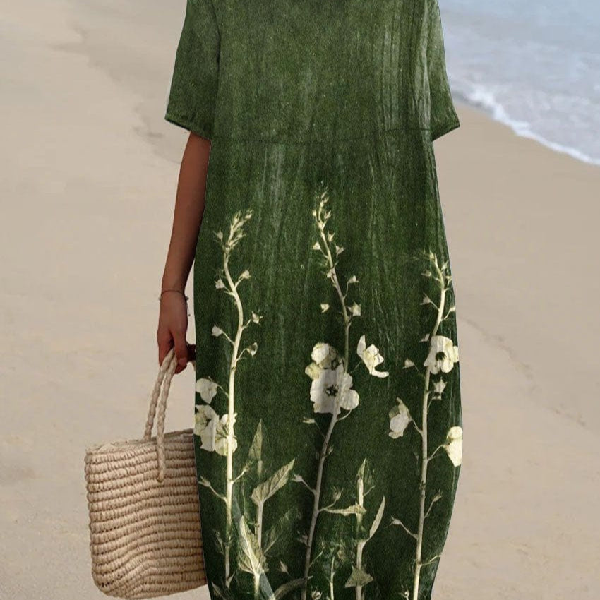 Women's floral summer dress, lightweight airy fabric, elegant beach-ready style with multicolored print