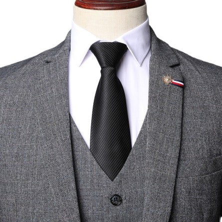 Men's grey herringbone tweed three-piece suit classic Peaky Blinders fit with vintage texture
