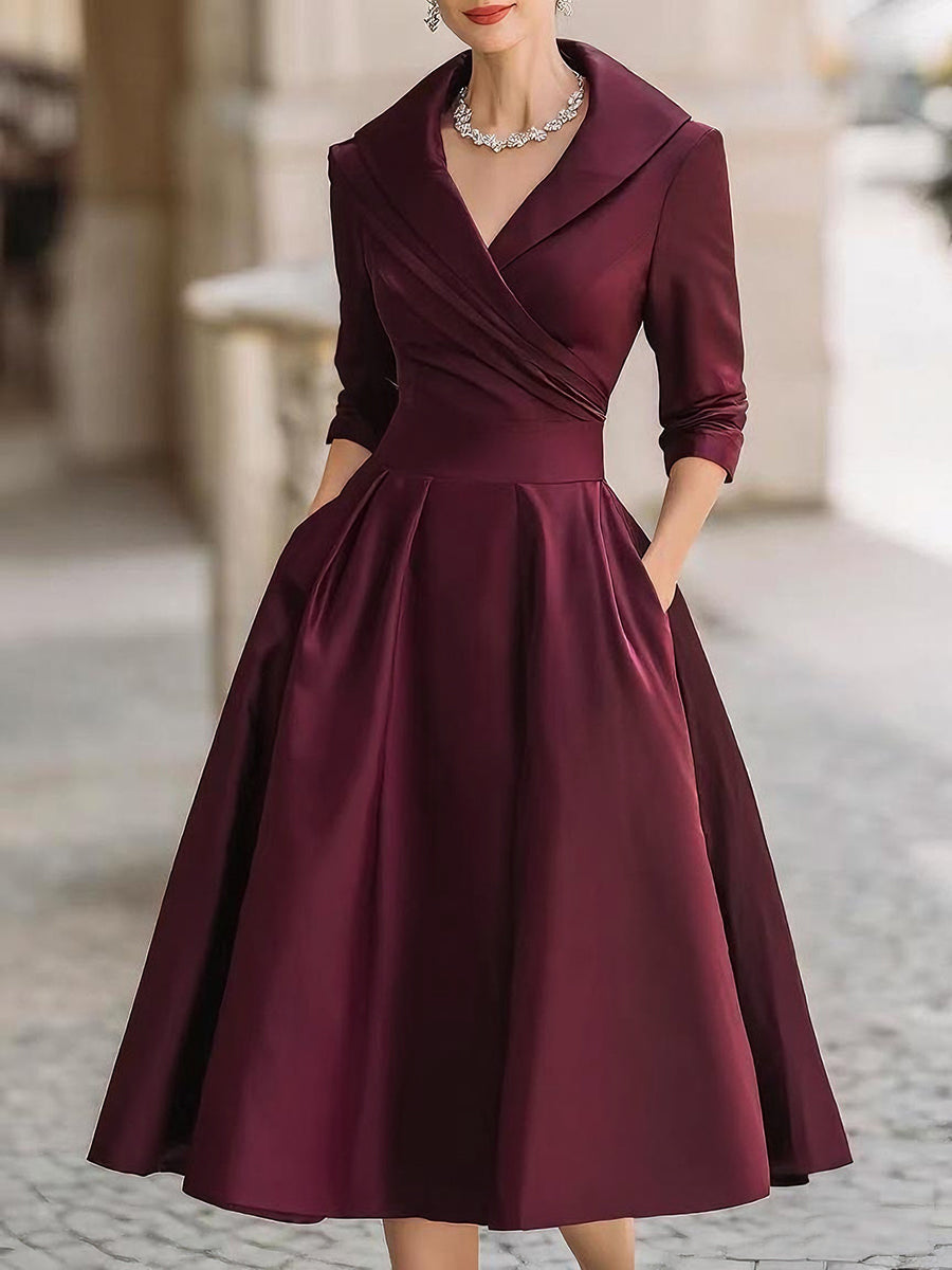 Women's black evening midi dress with wrap collar and fitted flare silhouette for formal occasions