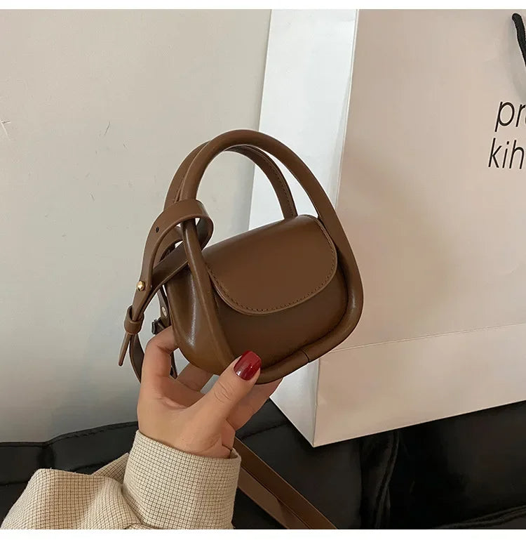 Élan mini satchel bag rounded silhouette curved handle compact chic shoulder bag for women