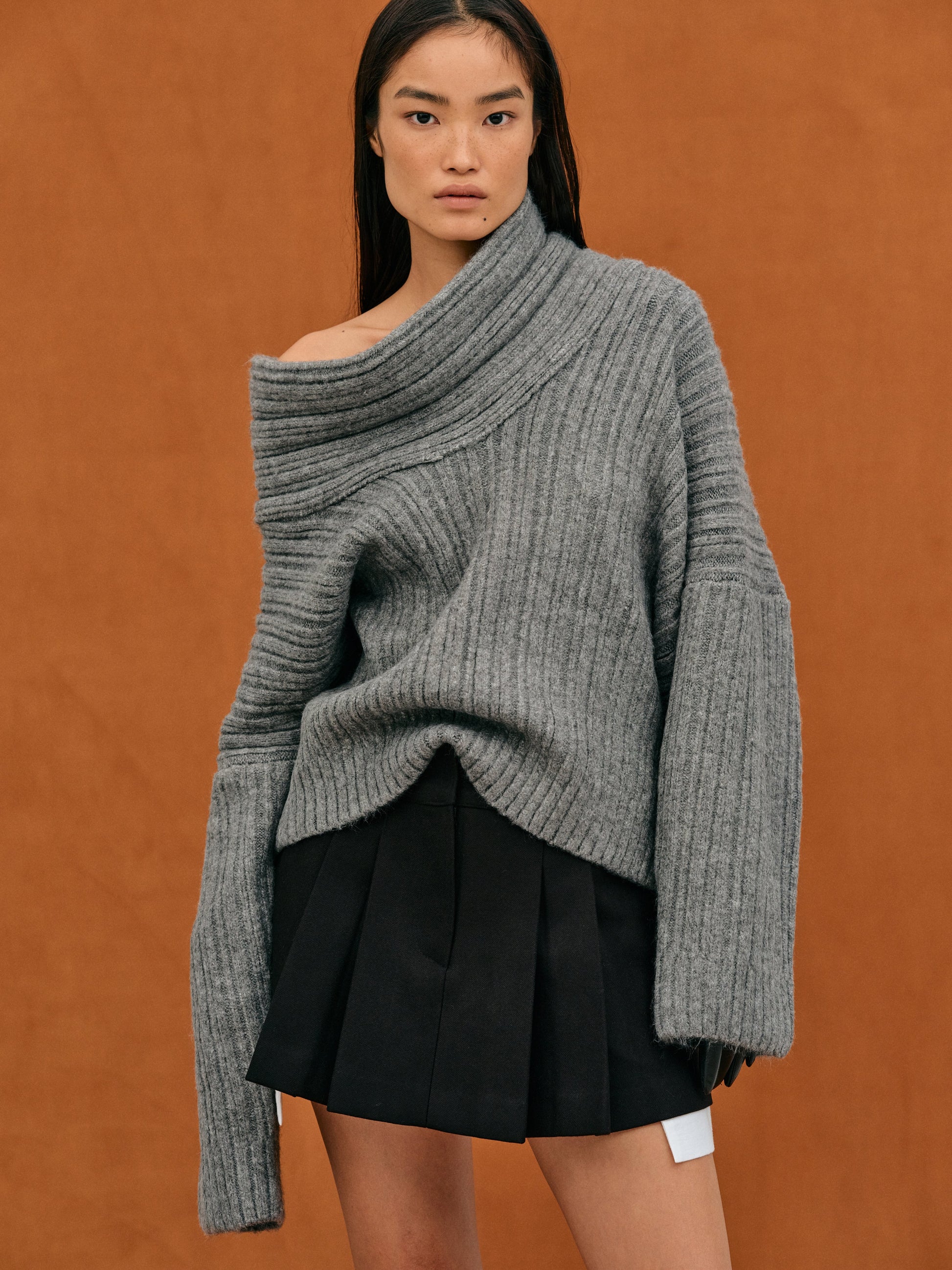 Women's oversized off-shoulder knitted sweater with ribbed texture, cozy relaxed fit for everyday wear