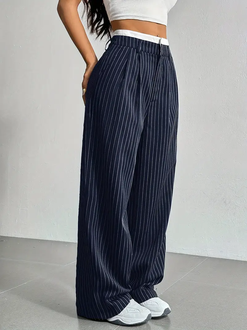 Navy blue pinstripe wide-leg trousers with elastic waistband, relaxed tailored silhouette for city wear