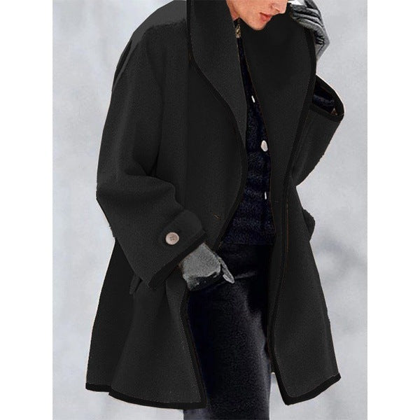 Women's loose fit coat with contrast piping trim, wide collar, elegant cut, bold detailing